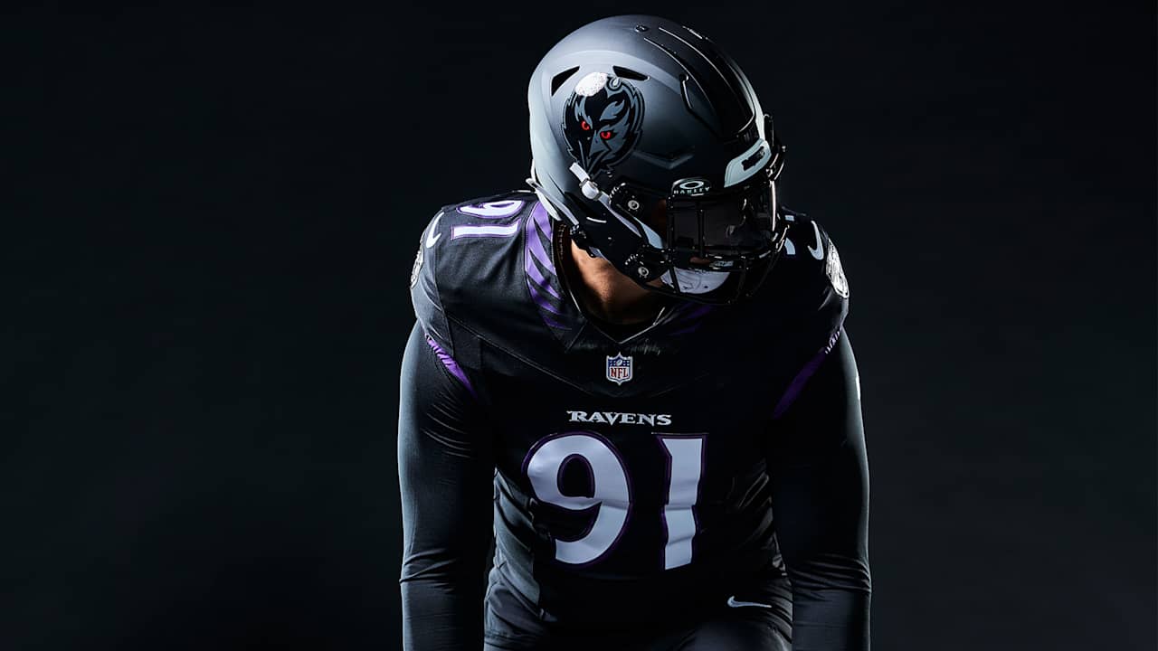 Ravens player in black alternate uniform